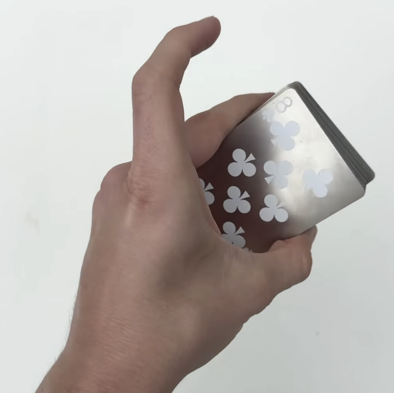 Steel Deck — eight of clubs card in hand