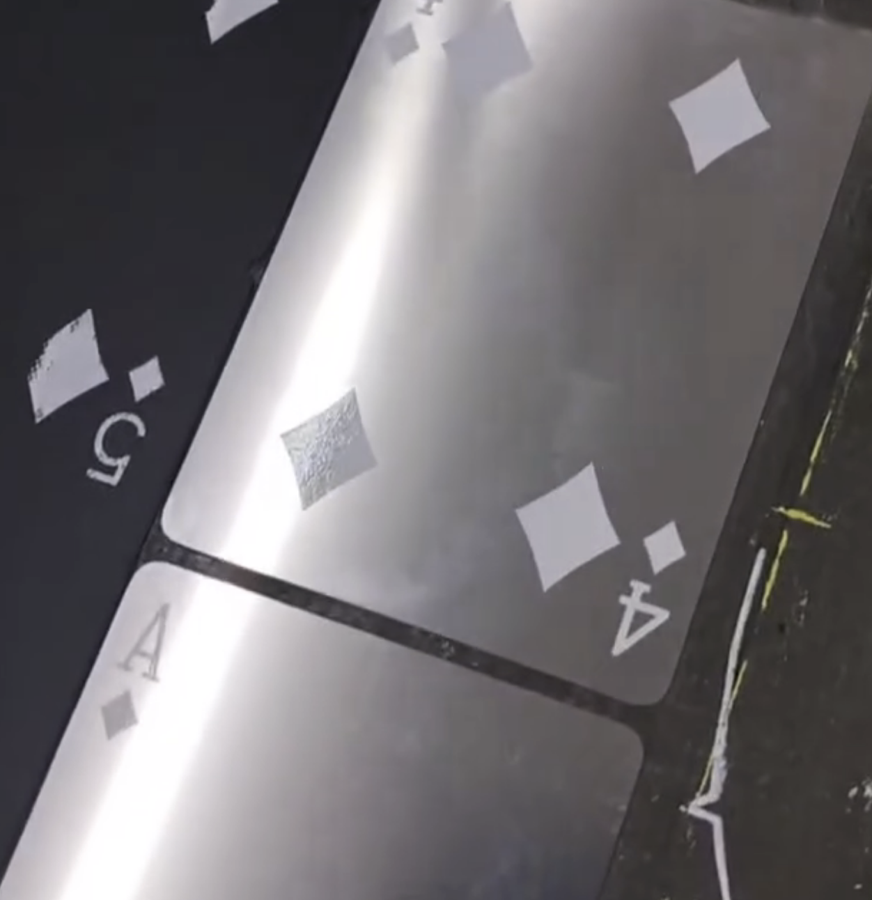 Steel Deck — cards under raking light